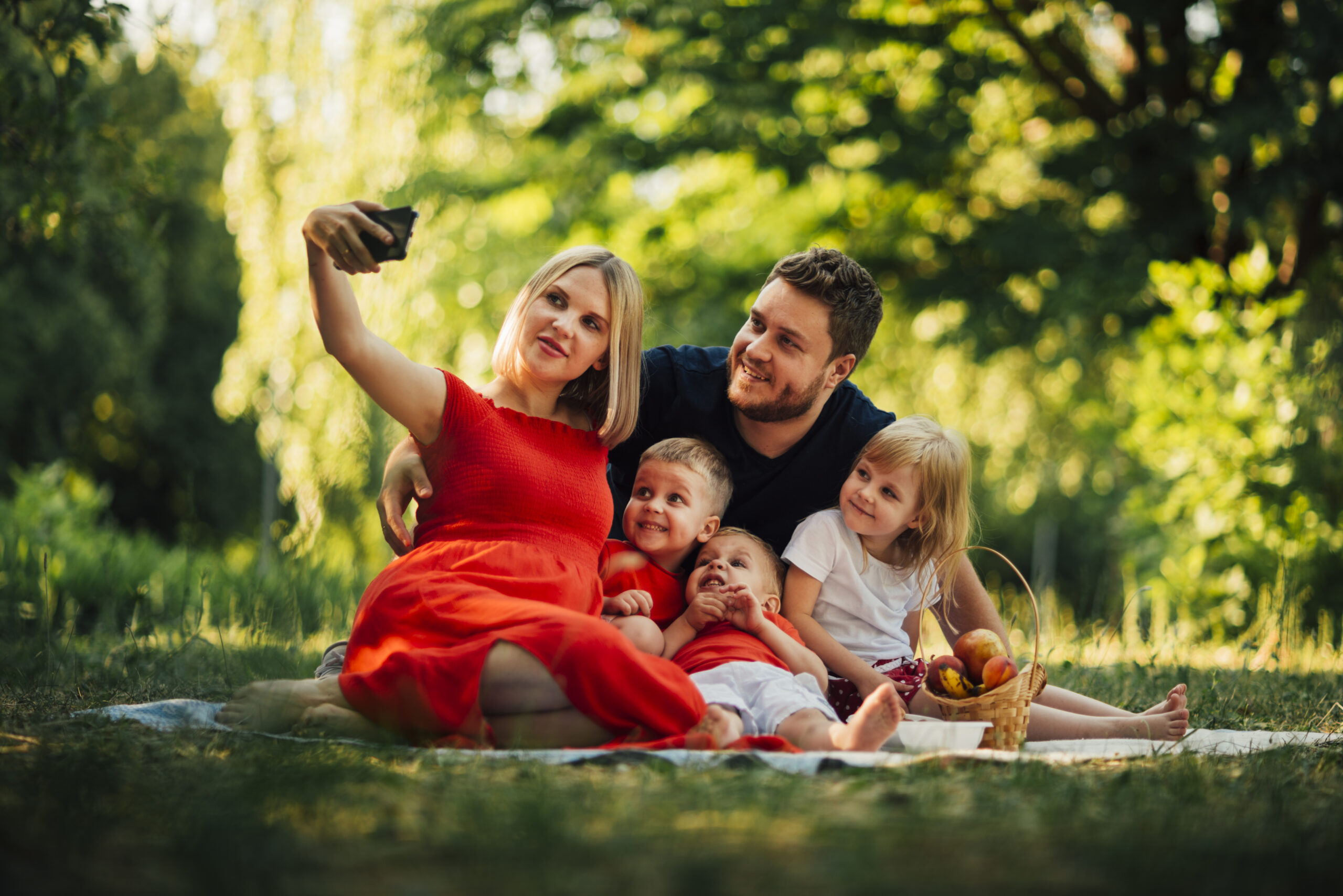 mother-taking-family-selfie-outdoors